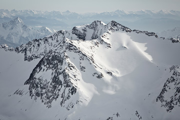 Fototapeta na wymiar Austrian Mountains in the Alps of Tyrol. Alpine Winter landscape and mountain panorama in Europe. Glacier Stubaier Gletscher Skiing area near Innsbruck. Majestic scenery