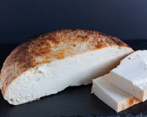 Ricotta cheese. Appetizing slices of baked ricotta, national italian cuisine.