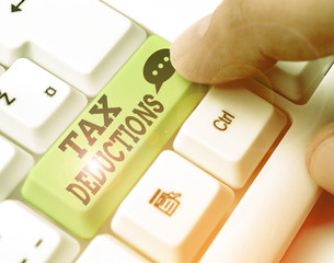 Conceptual hand writing showing Tax Deductions. Concept meaning amount or cost that can be...