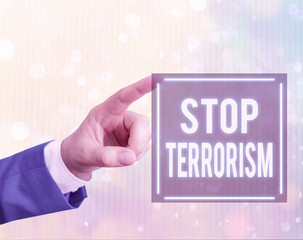 Handwriting text writing Stop Terrorism. Conceptual photo Resolving the outstanding issues related...