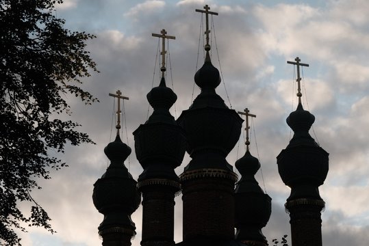 Backlight Christian domes against the sky