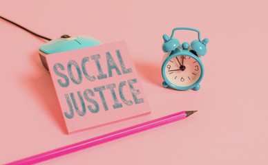 Word writing text Social Justice. Business photo showcasing Equal access to wealth and privileges within a society Vintage alarm clock wire mouse empty notepad markers colored background