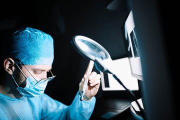 Scientist doctor in the laboratory examines the samples of the virus in vitro. vaccine development...