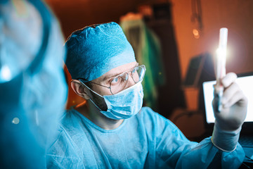 Scientist doctor in the laboratory examines the samples of the virus in vitro. vaccine development concept