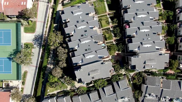 Aerial view of typical community condo with tennis court and pool. Solana Beach, South California. USA