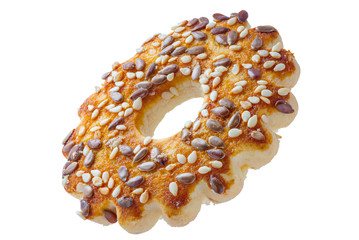 Cookies in the form of rings with sesame seeds and flax. Cut out on a white background with a pen tool. Full depth of field.