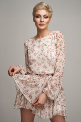 Fashion beautiful elegant woman posing in short summer dress