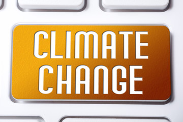 Orange Climate Change Button On A White Keyboard, Fragile Future Concept
