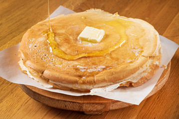 Sweet Homemade Stack of Pancakes with Butter and Honey