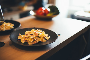 Fresh hot home made pasta on kitchen table.