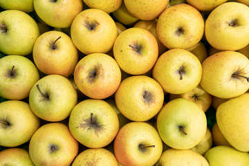 Basket with fresh ripe green apple fruits on sale in grocery food store.Supermarket shop,natural foods department.Eat vitamines