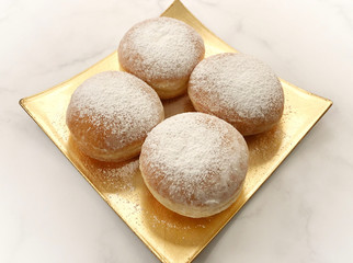 Classic doughnut with jam, filling with icing sugar.