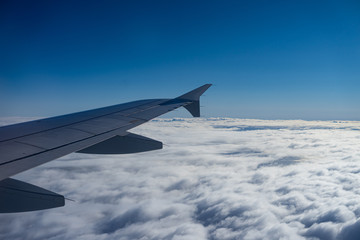 Fototapeta na wymiar flight above the sky wing view