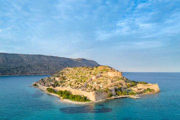 Fototapeta na wymiar Aerial view of the island of Spinalonga with calm sea. Here were isolated lepers, humans with the Hansen's desease, gulf of Elounda, Crete, Greece.