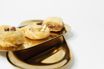 Baklava sweet dessert. Pastry made of layers of filo filled with chopped nuts and sweetened and held together with syrup or honey 