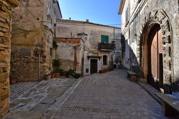 A narrow street between the old houses of a medieval village