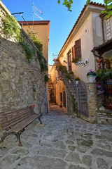 A narrow street between the old houses of a medieval village