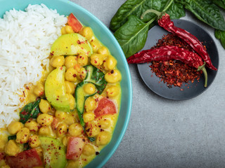 rice, chickpeas, zucchini, with coconut milk and curry  sauce. vegetarian dish
