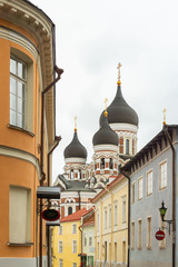 Fototapeta na wymiar Domes of Alexander Nevsky Cathedral in Tallinn is built in a typical Russian Revival on Toompea hill. The largest orthodox cupola cathedral seen from the intersection of Kohtu, Kiriku plats, Piiskopi.
