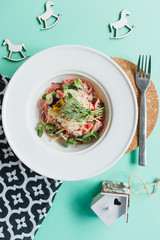 Close-up view of salad in white plate 