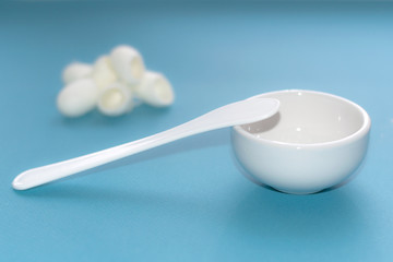 Apparatus and tools for ultrasonic face cleaning. Personal hygiene and health concept. Flat lay. Brushes Tools for mechanical cleaning of the face on a blue background.  peeling and beauty treatments