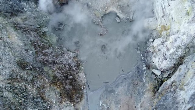 Aerial view of Volcanic Activity Boiling Geothermal Mud Pot In Crater Of Active Volcano
