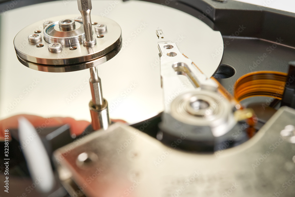 Poster hdd. inside of hard disk - magnetic disk with a reading head. close-up photo