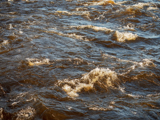 Fast flow in a river with waves crushing and ripples, Abstract nature background, Concept nature energy and flow.
