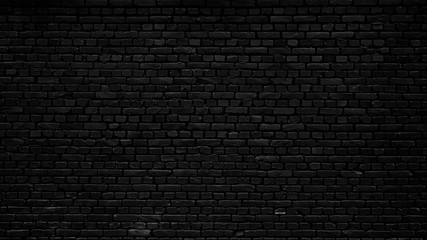 Black brick wall as background or wallpaper or texture