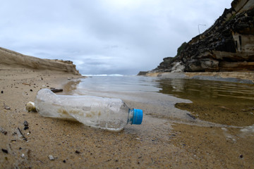Fototapeta na wymiar Plastic bottle on the beach, Sydney Australia