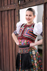 Young beautiful slovak woman in traditional costume