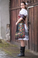 Fototapeta na wymiar Young beautiful slovak woman in traditional costume
