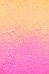 Abstract metal texture with spray can of paint a gradient of yellow and pink. Vertical.