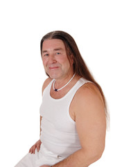 Portrait of an indigenous man with long hair in under shirt