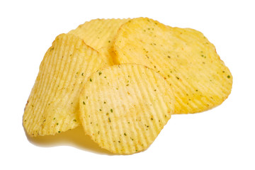 Several pieces of potato chips with spices on a white background. Isolated.