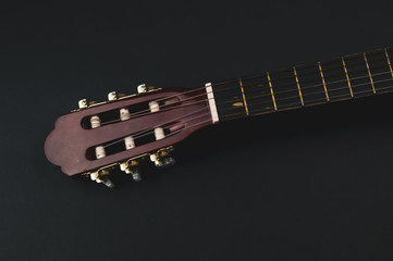 Guitar headstock close up. acoustic musical instrument