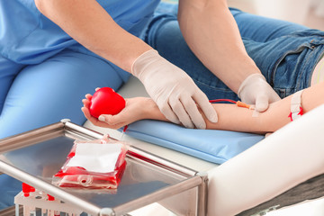 Woman donating blood in hospital