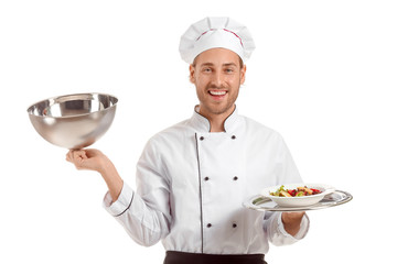 Happy male chef with prepared dish on white background