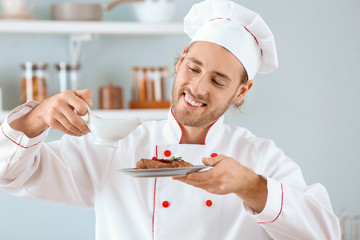 Male chef cooking in kitchen
