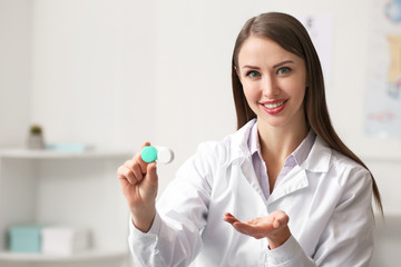 Ophthalmologist with contact lenses in clinic