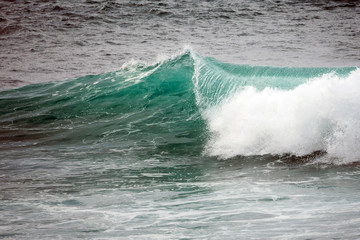 Turquoise waves crashing and splashing