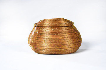 handmade basket of typical golden grass from brazil isolated on white background