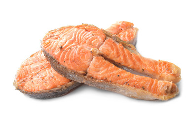 Fried salmon steaks on white background