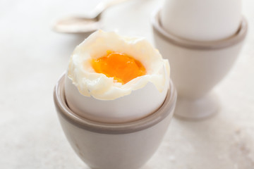 Tasty boiled egg on table