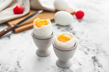 Tasty boiled eggs on table