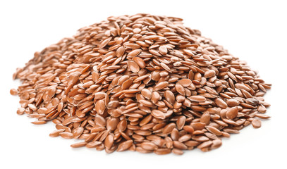 Heap of flax seeds on white background