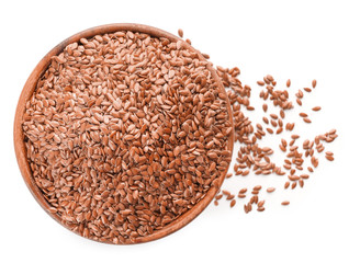 Bowl with flax seeds on white background