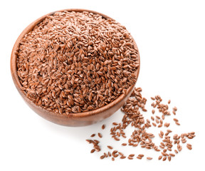 Bowl with flax seeds on white background