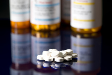 White Tablets With Prescription Bottles