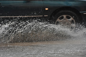 water under the wheel of a car